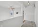 Bright, airy hallway featuring neutral tones, a modern light fixture, and a view to the first floor at 2434 N Pennsylvania St, Indianapolis, IN 46205