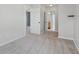 Neutral hallway with carpet and multiple doors to bedrooms and bathrooms at 2434 N Pennsylvania St, Indianapolis, IN 46205