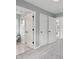 Hallway leading to bedroom and bathroom, with plush carpet, and neutral paint at 2434 N Pennsylvania St, Indianapolis, IN 46205