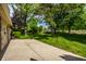 A well-maintained backyard with a concrete patio and lush, green grass at 725 Sugarbush Dr, Zionsville, IN 46077