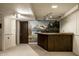 Finished basement with a custom-built bar, carpet, and scenic mountain mural at 725 Sugarbush Dr, Zionsville, IN 46077