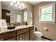 Bathroom featuring granite countertop, wood cabinets, and natural light from the window at 725 Sugarbush Dr, Zionsville, IN 46077