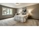 Bright bedroom with large window, neutral tones, and comfortable furniture at 725 Sugarbush Dr, Zionsville, IN 46077