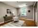 Cozy bedroom featuring hardwood floors, a large window and neutral paint at 725 Sugarbush Dr, Zionsville, IN 46077