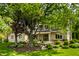 Charming two-story home featuring stone accents, well-maintained landscaping, and mature trees at 725 Sugarbush Dr, Zionsville, IN 46077