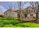 Beautiful two-story home with stone and siding exterior, lush lawn, and inviting curb appeal at 725 Sugarbush Dr, Zionsville, IN 46077
