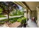 Inviting front porch with detailed stone work, decorative foliage, and a serene neighborhood view at 725 Sugarbush Dr, Zionsville, IN 46077