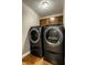 Laundry room with newer gray washing machine and dryer set at 725 Sugarbush Dr, Zionsville, IN 46077