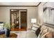 Cozy living room featuring hardwood floors, a plush sofa, and stylish decor at 725 Sugarbush Dr, Zionsville, IN 46077