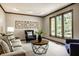 Inviting living room featuring a large window with backyard view, and comfortable decor at 725 Sugarbush Dr, Zionsville, IN 46077