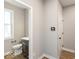 Small bathroom with toilet, sink, and cabinet at 12212 Tidecrest Dr, Fishers, IN 46037