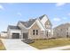 Two-story home with stone and gray siding at 12212 Tidecrest Dr, Fishers, IN 46037