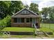 Charming one-story home with a brick foundation and covered front porch at 2221 Langley Ave, Indianapolis, IN 46218