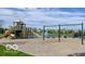 Community playground featuring slides, swings, and a scenic view of the neighborhood pond at 13094 Overview Dr # 5D, Fishers, IN 46037