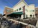 The Bonn Building is home to a pizza restaurant with outdoor seating and well landscaped entryway at 13094 Overview Dr # 5D, Fishers, IN 46037