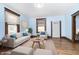 Light-filled living room features hardwood floors, comfy seating, and a coffee table at 1117 N Parker Ave, Indianapolis, IN 46201