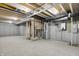 Unfinished basement showcasing HVAC and plumbing at 1647 Sheldon St, Indianapolis, IN 46218