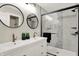 Modern bathroom with double vanity and walk-in shower at 1647 Sheldon St, Indianapolis, IN 46218