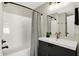 Modern bathroom with dark vanity and white sink at 1647 Sheldon St, Indianapolis, IN 46218