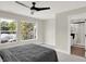 Bedroom with ensuite bath and ceiling fan at 1647 Sheldon St, Indianapolis, IN 46218