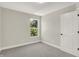 Spacious bedroom featuring grey carpet and a window at 1647 Sheldon St, Indianapolis, IN 46218