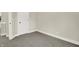 Grey carpeted bedroom with white trim and doors at 1647 Sheldon St, Indianapolis, IN 46218