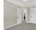 Bright bedroom with grey carpet and access to bathroom at 1647 Sheldon St, Indianapolis, IN 46218