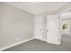 Spacious bedroom with grey carpet and neutral walls at 1647 Sheldon St, Indianapolis, IN 46218