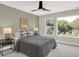 Spacious bedroom with ceiling fan and large windows at 1647 Sheldon St, Indianapolis, IN 46218