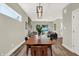 Open dining room with a wood table, black chairs, and views of the living room at 1647 Sheldon St, Indianapolis, IN 46218