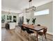 Dining room features a wood table, black chairs, and a view of the kitchen at 1647 Sheldon St, Indianapolis, IN 46218