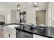 Modern kitchen island with a farmhouse sink and black countertop at 1647 Sheldon St, Indianapolis, IN 46218