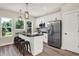 Modern kitchen with white cabinets, stainless steel appliances, and an island at 1647 Sheldon St, Indianapolis, IN 46218