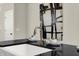 Modern kitchen sink and faucet with black countertop at 1647 Sheldon St, Indianapolis, IN 46218