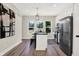 Modern kitchen with white cabinets, stainless steel appliances, and an island at 1647 Sheldon St, Indianapolis, IN 46218