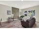 Spacious living room featuring a gray sofa, accent chairs, and an eye-catching wall feature at 1647 Sheldon St, Indianapolis, IN 46218