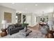 Open concept living room with hardwood floors, comfortable seating, and a view of dining area at 1647 Sheldon St, Indianapolis, IN 46218