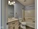 Charming bathroom features a vanity, mirror, and a shower-tub combo at 2225 Shadowbrook Dr, Plainfield, IN 46168