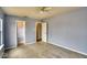 Bright bedroom features carpet, ceiling fan, and easy access to closet space at 2225 Shadowbrook Dr, Plainfield, IN 46168