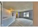 Large carpeted room offering versatile space and natural light from a window at 2225 Shadowbrook Dr, Plainfield, IN 46168