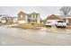 Street view of a two-story home featuring brick and siding, a green lawn, and a mailbox at 2225 Shadowbrook Dr, Plainfield, IN 46168