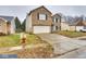 Two-story home with brick and siding, concrete driveway, and well-manicured lawn at 2225 Shadowbrook Dr, Plainfield, IN 46168