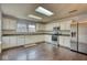 Kitchen with white cabinetry, stainless steel appliances, and tiled backsplash at 2225 Shadowbrook Dr, Plainfield, IN 46168