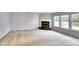 Spacious living room with fireplace and large windows offering natural light at 2225 Shadowbrook Dr, Plainfield, IN 46168