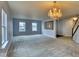 Open-concept living room featuring a chandelier and lots of natural light at 2225 Shadowbrook Dr, Plainfield, IN 46168