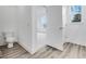 Neutral bathroom featuring a toilet and doorway into an adjoining room at 5743 Cr W 750 N, McCordsville, IN 46055