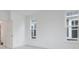 Sunlit bedroom with white walls, neutral carpeting, and many windows at 5743 Cr W 750 N, McCordsville, IN 46055
