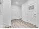 Bright entryway with white walls, wood-look floors, and two entry doors at 5743 Cr W 750 N, McCordsville, IN 46055