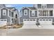 Newly constructed grey townhomes with white garage doors and concrete driveway at 5743 Cr W 750 N, McCordsville, IN 46055