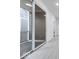 Hallway with a sliding glass door leading to a balcony with a wooden floor at 5743 Cr W 750 N, McCordsville, IN 46055